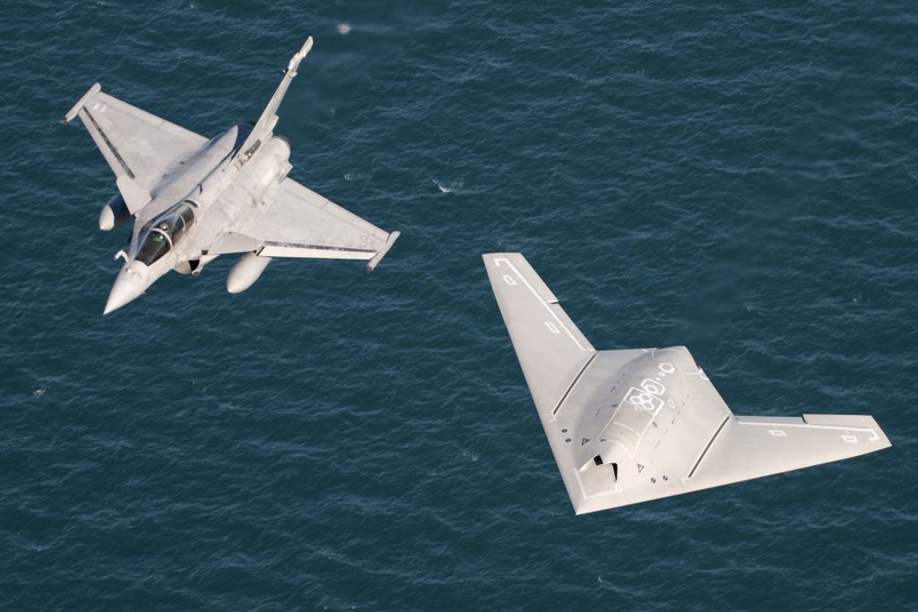 nEUROn and Rafale M in flight over the aircraft carrier.